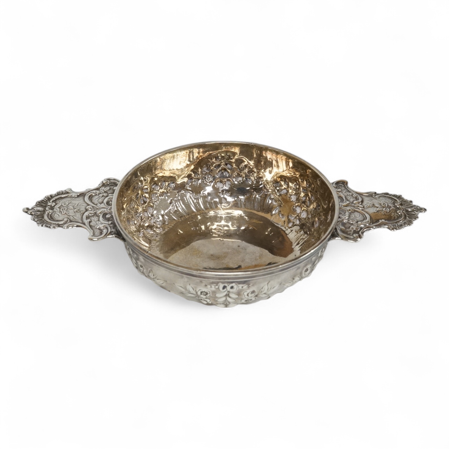 An early 20th century French 950 standard white metal taste vin, embossed with foliage, 20cm, over handles, 4.5oz.